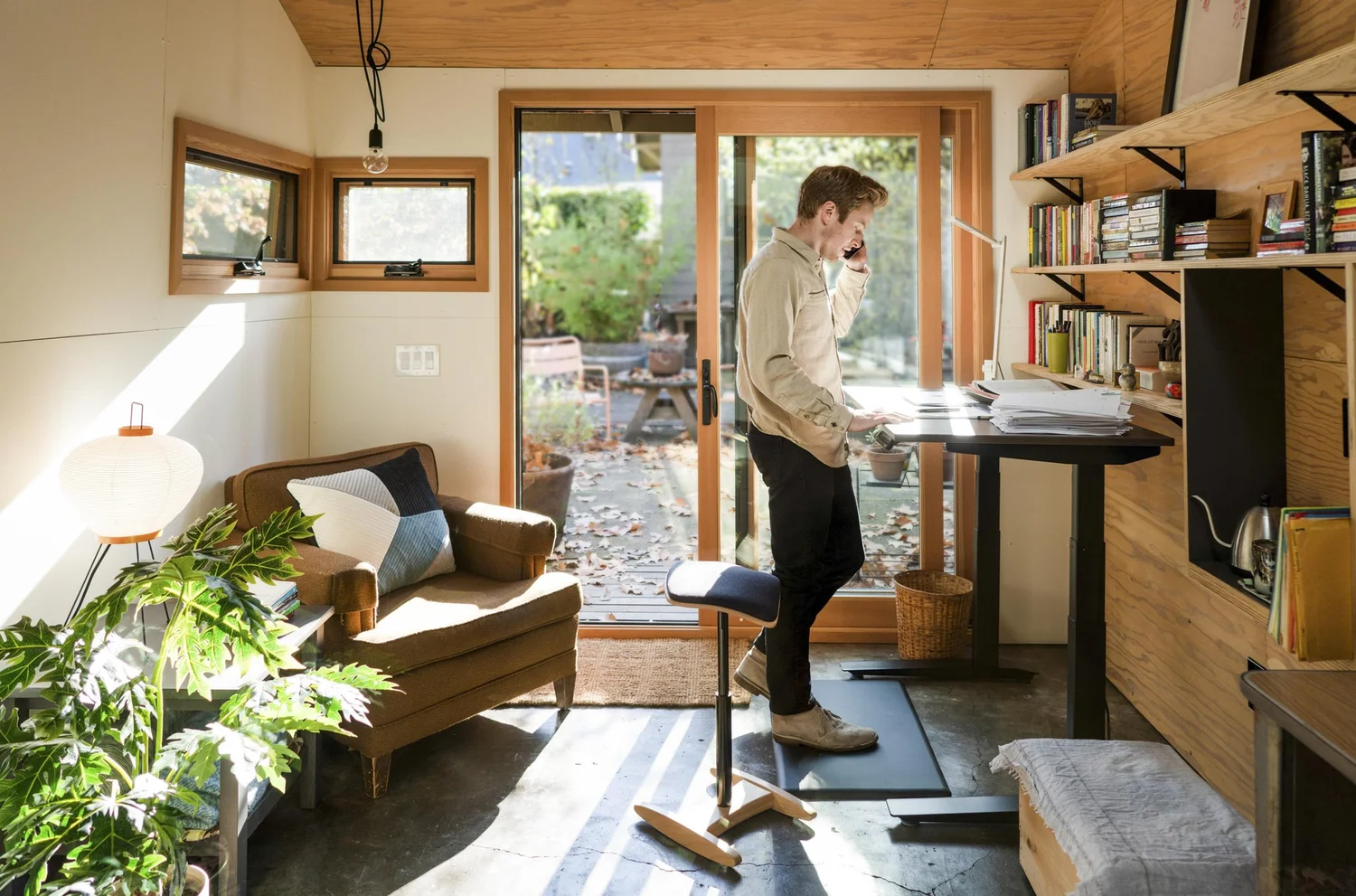 Professional in a warm art-filled home office