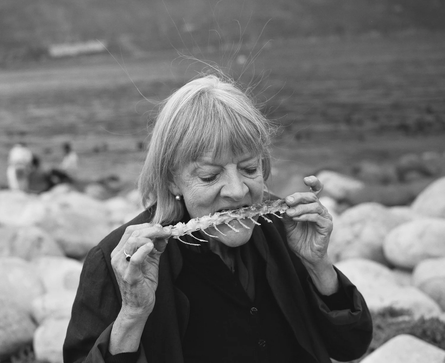 Black-and-white editorial photograph beside the shore